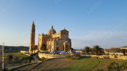 a large church with a tower next to it in Malta, Gozo.