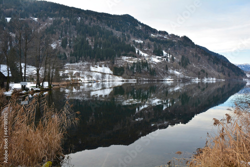 The snowy December landscape at Afritzer See Lake in Carinthia, Austria. Located in the Gegendtal Valley, it is in the Nock Mountains of the Gurktal Alps photo