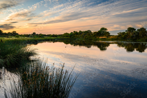 Sunset at Embleton Quarry  Nature Reserve Pond, a former whinstone quarry the new reserve is a tribute to the local community in the coastal village of Embleton who developed the site
