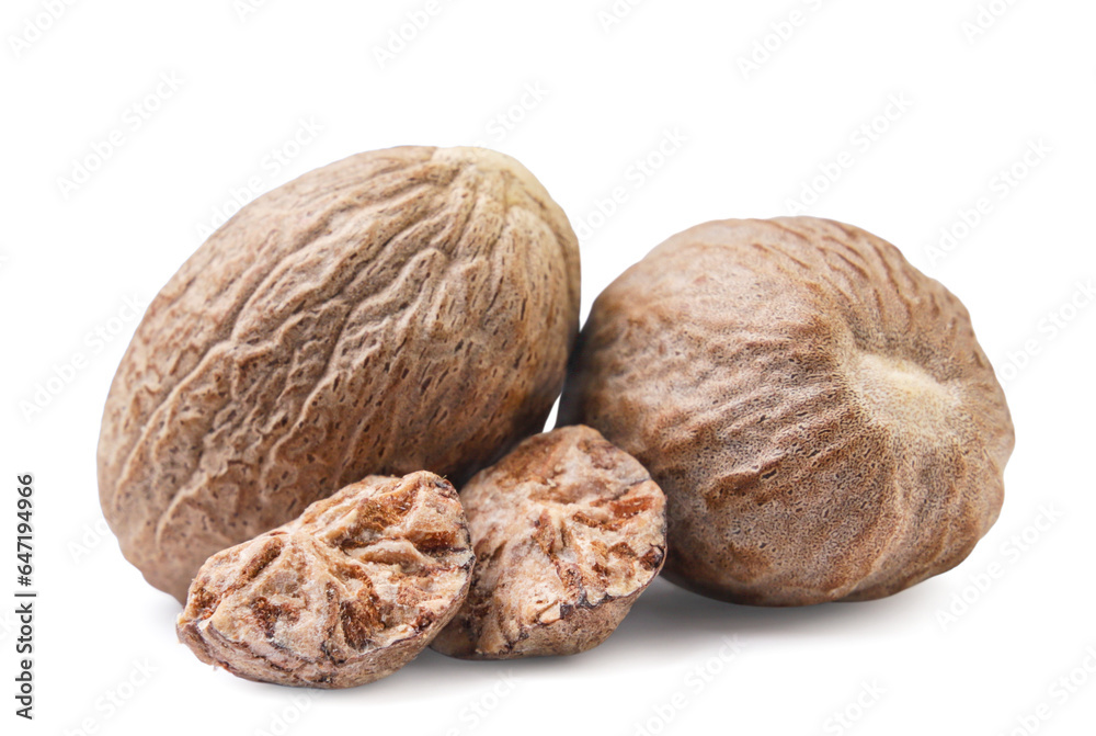 Nutmeg and pieces close-up on a white background. Nutmeg and pieces close-up on a white background.