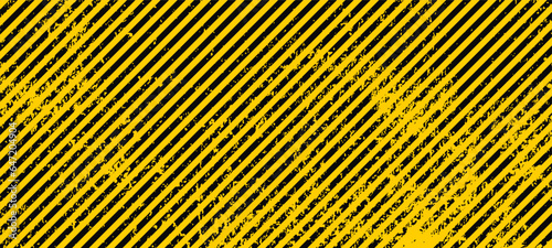 Grunge yellow and black diagonal stripes. Industrial warning background, warn caution, construction, safety