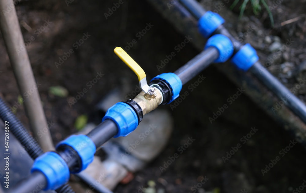 Water valve connected to PVC pipe. Irrigation system for fields concept