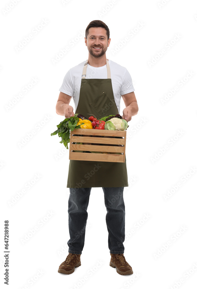 Harvesting season. Happy farmer holding wooden crate with vegetables on white background Harvesting season. Happy farmer holding wooden crate with vegetables on white background