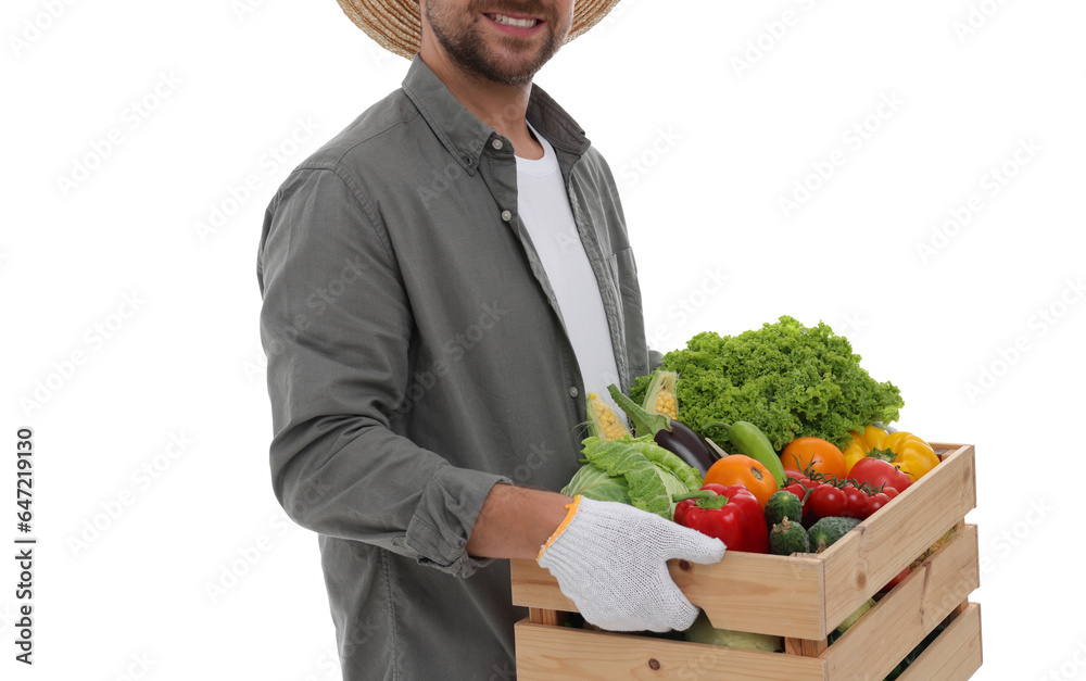 Harvesting season. Happy farmer holding wooden crate with vegetables on white background, closeup Harvesting season. Happy farmer holding wooden crate with vegetables on white background, closeup