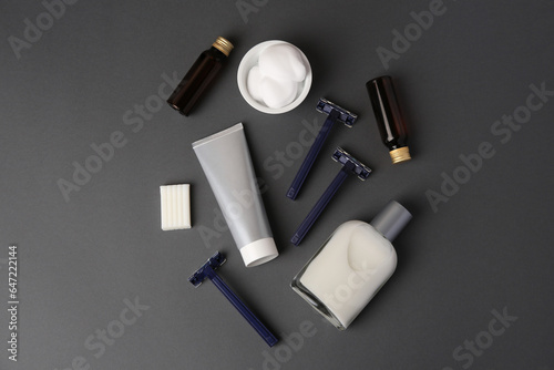 Flat lay composition with shaving accessories for men on grey background