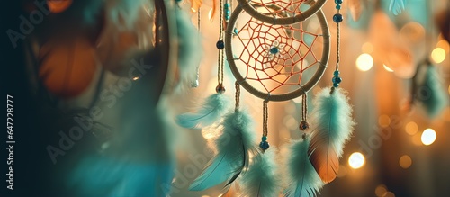 Close up of dream catcher with fresh green feathers