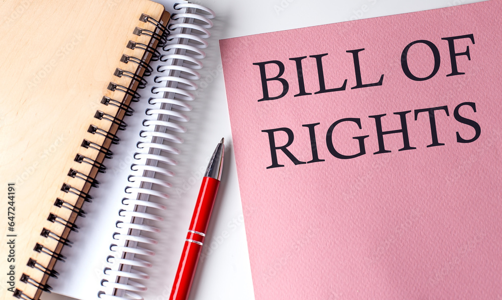 BILL OF RIGHTS word on the pink paper with office tools on white background