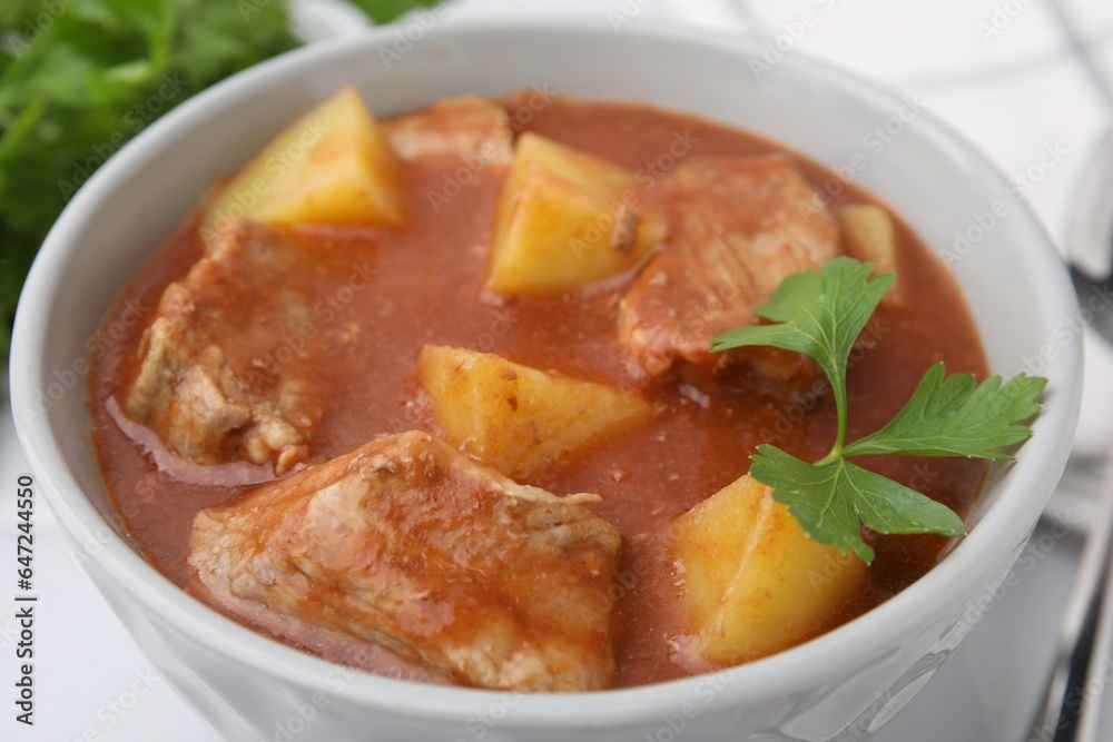 Delicious goulash with parsley in bowl, closeup Delicious goulash with parsley in bowl, closeup