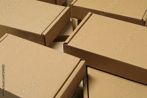Many closed cardboard boxes as background, closeup
