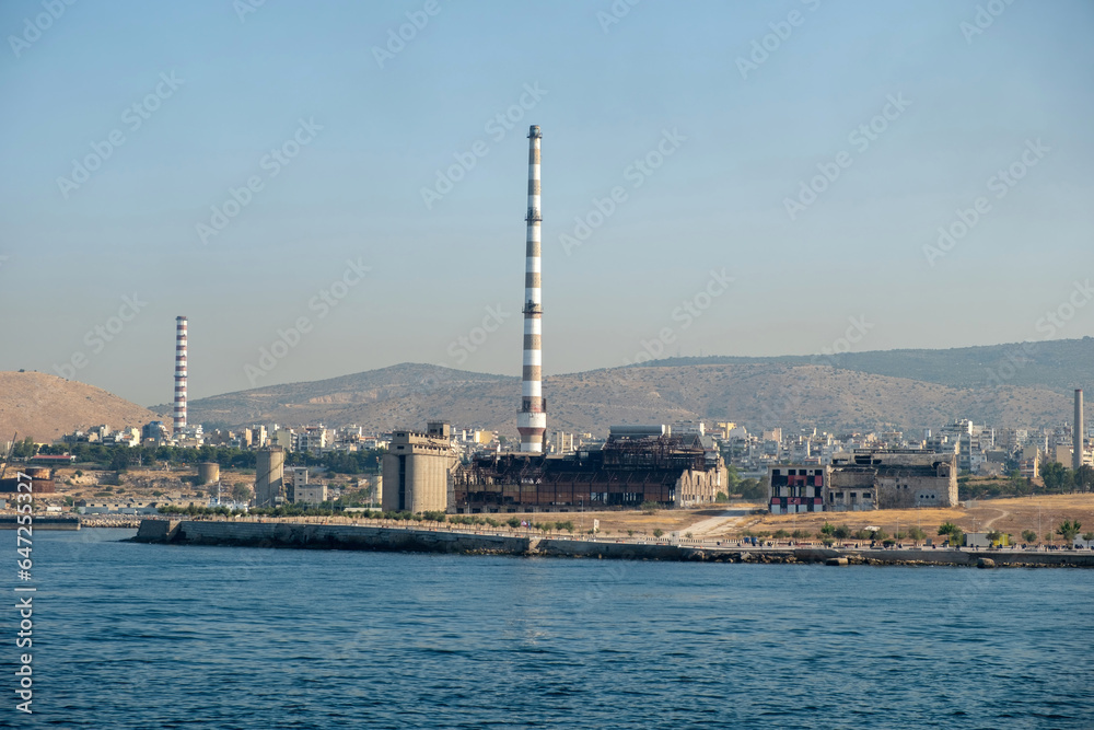 Fertilizer factory ruins and port in Piraeus Greece. Old abandoned factory industrial plant.