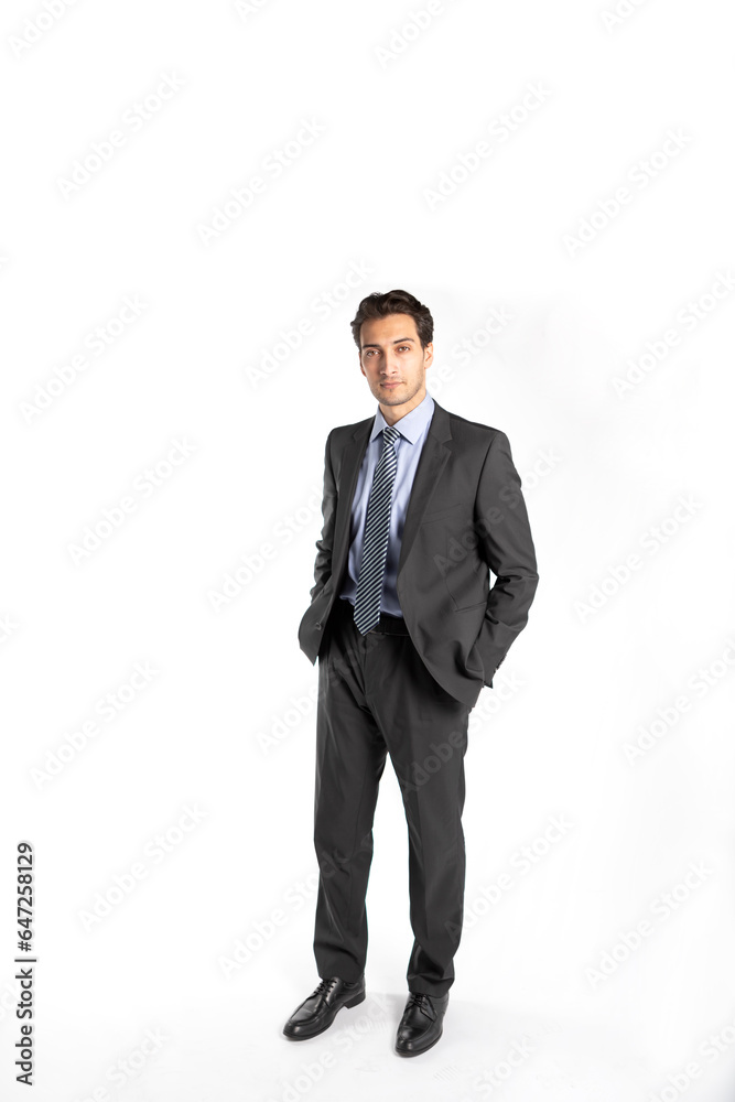 Handsome businessman in black suit stands isolated on white background Handsome businessman in black suit stands isolated on white background