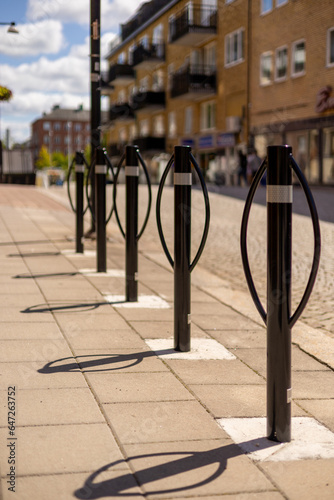 Black street poles in a row