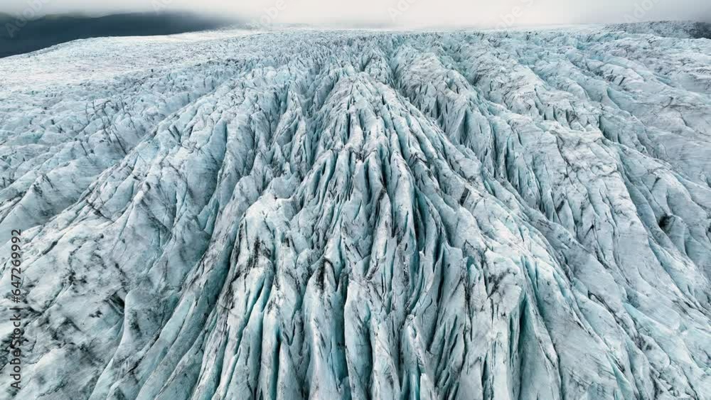 Aerial view of white glacier. Epic Drone Shot iceberg in national park in Iceland.