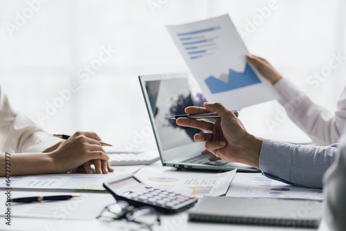 Businessmen colleague brainstorming discussion chart analytics financial report and growth marketing for business plan together.