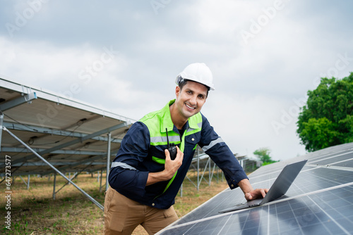 portrait Electrical engineer in a solar power plant photovoltaic alternative electric power. solar panels for solar energy in a power plant.