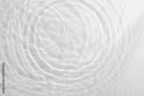 Water banner background. White water texture, water surface with rings and ripples © Yevhenii