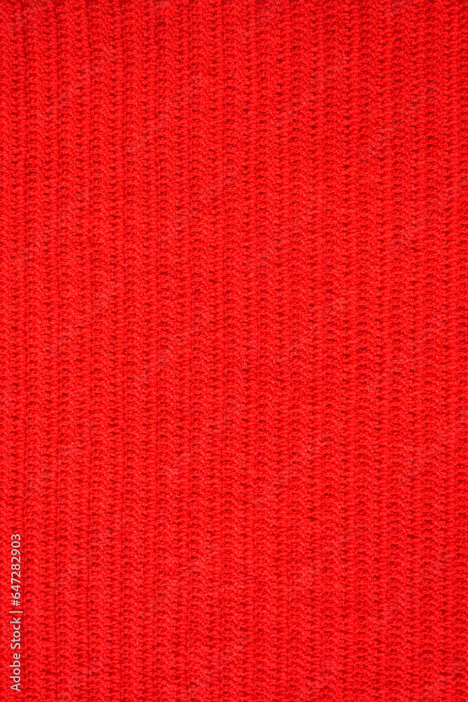 Fototapeta premium texture of red wool knitted yarn, woolen fabric background