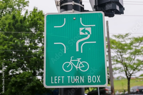 Bicycle lane LEFT TURN BOX with arrows indicating how to make the left turn for the bicyclists. Bike lane intersection 