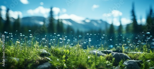 Dew bubble on grass at blurred mountain and forest landscape. Generative AI technology.