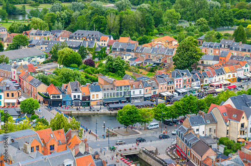 Aerial view of Amiens historical city centre with Saint-Leu quarter rows of colourful houses with street restaurants on Somme river embankment, Somme department, Hauts-de-France Region, France