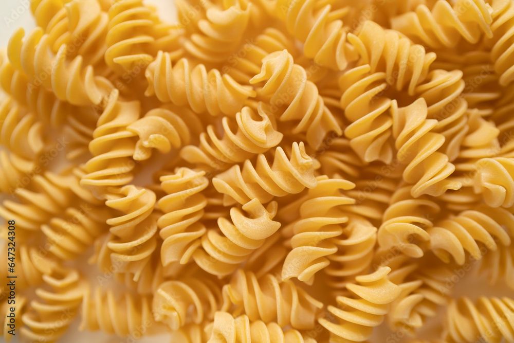 Texture of durum wheat semolina pasta called Fusilloni typical of the Amalfi coast. Gragnano pasta, bronze die, Naples Italy Texture of durum wheat semolina pasta called Fusilloni typical of the Amalfi coast. Gragnano pasta, bronze die, Naples Italy