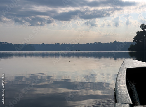 Boat on Sandoval Lake, Puerto Maldonado, Peru, South America. Visit during the sunrise to Lago Sandoval in the Amazonian region of Madre de Dios, Puerto Maldonado, Peru. photo