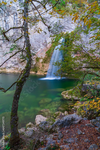 autumn season and ilica waterfall between the rocks and the colors of nature