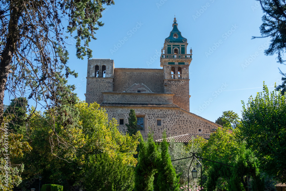 View of the pretty Mallorcan village of Valldemossa, in the protected natural area of the Sierra de Tramuntana, on a sunny summer morning