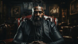 Portrait of a bearded African American man in black leather jacket.