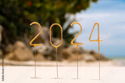 Numbers for 2024 for the coming New Year on a tropical beach. Celebration concept in an exotic country