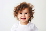a child with curly hair wearing a white t-shirt on a white background