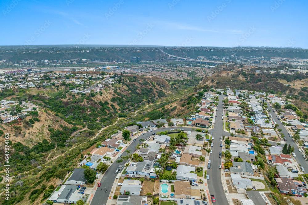 Aerial view of house in Serra Mesa City in San Diego, California, USA. Green Dry Valley and Villas