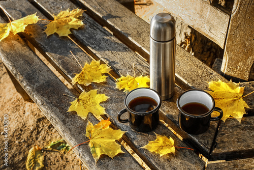 Thermos with cups of coffee...