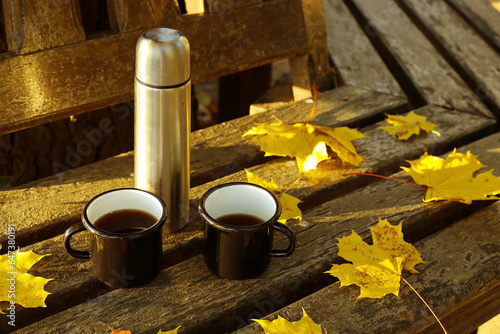 Thermos with cups of coffee...