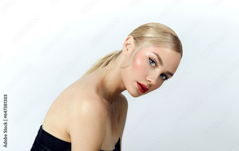 Obraz premium Beautiful young blue-eyed woman with natural make-up and long thick dark hair. Woman in white top.Advertising hair cosmetics, hair care, going to a beauty salon.