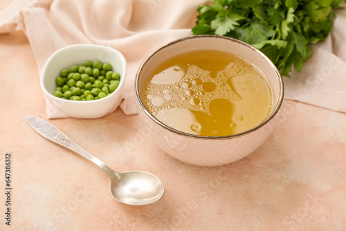 Warm chicken broth in a bow...