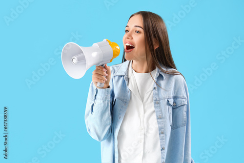 Young woman shouting into m...