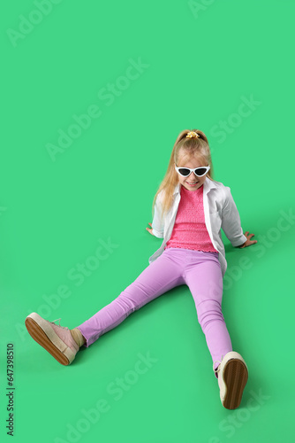 Stylish little girl sitting...