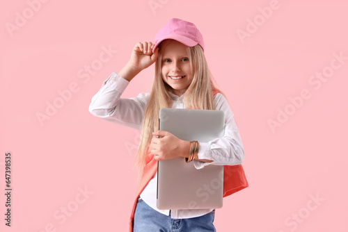 Little girl with laptop on ...