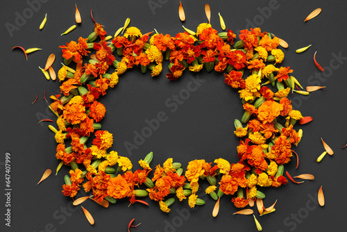 Frame made of marigold flowers on black background. Divaly celebration photo