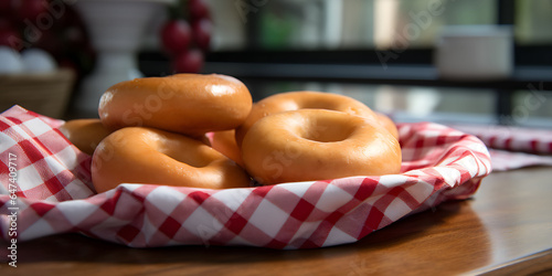 Unglazed donuts on kitchen table, checkered manel photo