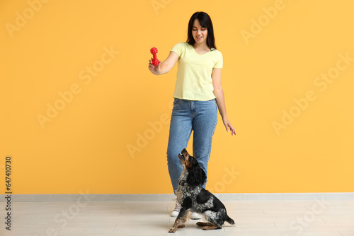 Young woman playing with he...
