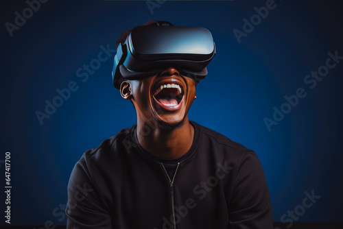 Young excited man trying on virtual reality simulator glasses in his living room, having fun and smiling while looking at virtual realty © VisualProduction