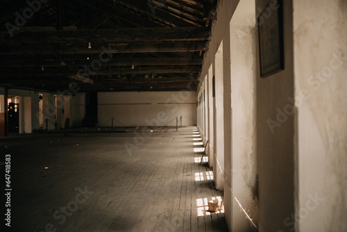 Very old abandoned factory warehouse with wooden floors and windows and clay tiles.