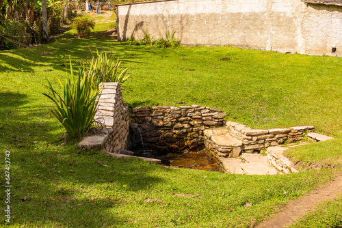Fountain in a bucolic alley in the Milho Verde district photo