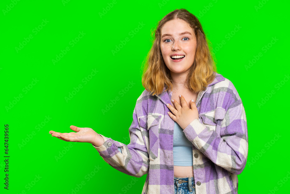Young woman showing thumbs up and pointing left empty place, advertising area for commercial text, copy space for goods promotion advertisement. Girl isolated on chroma key background. Lifestyles Young woman showing thumbs up and pointing left empty place, advertising area for commercial text, copy space for goods promotion advertisement. Girl isolated on chroma key background. Lifestyles