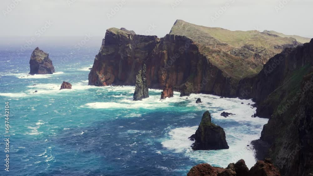 Beautiful views of Miradouro da Ponta do Rosto on a windy day with beautiful blue water