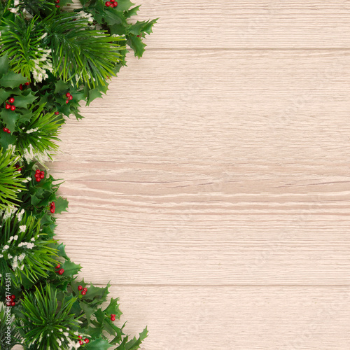 Christmas holiday background with empty wooden board . tree branches on a light wooden background. Flat lay. copy space