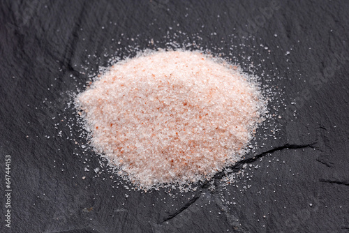 Fine grains of pink Himalayan salt, powder red rock salt from Pakistan
