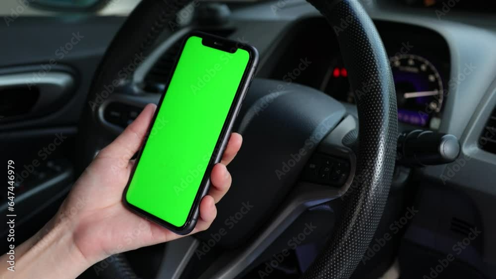 person driving car, phone green screen in hand, using phone on car person driving car, phone green screen in hand, using phone on car